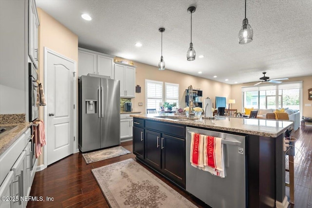141 Mediterra Ave, Ponte Vedra, FL 32081 - kitchen with stainless steel appliances, open floor plan, plenty of natural light, a center island with sink, and recessed lighting