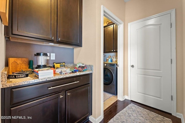 141 Mediterra Ave, Ponte Vedra, FL 32081 - laundry room featuring washer / dryer, cabinet space, and dark wood finished floors