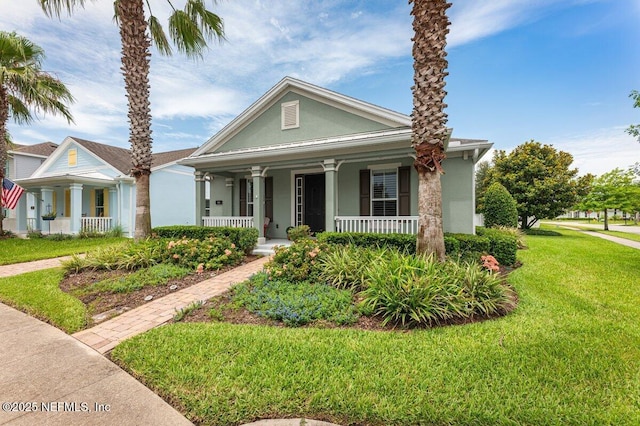 141 Mediterra Ave, Ponte Vedra, FL 32081 - view of front of home featuring a porch, stucco siding, and a front yard