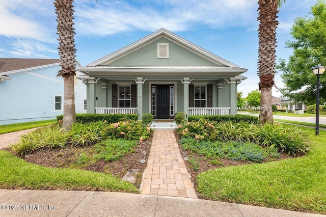 141 Mediterra Ave, Ponte Vedra, FL 32081 - view of front of house with covered porch and stucco siding