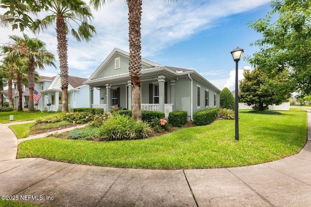141 Mediterra Ave, Ponte Vedra, FL 32081 - view of side of home with a porch, a lawn, and stucco siding