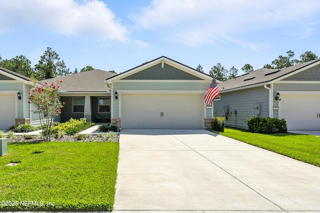 129 Oyster Shell Ter, Ponte Vedra, FL 32081 - view of front facade featuring a front yard, concrete driveway, and stone siding