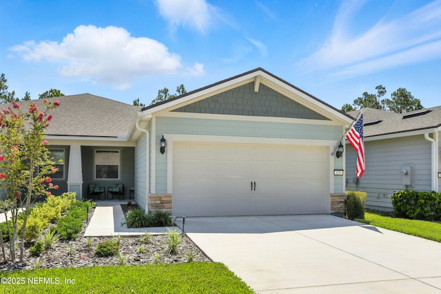 129 Oyster Shell Ter, Ponte Vedra, FL 32081 - view of front of house with stone siding, driveway, a garage, and roof with shingles