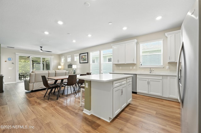 129 Oyster Shell Ter, Ponte Vedra, FL 32081 - kitchen featuring stainless steel appliances, open floor plan, a kitchen island, light countertops, and recessed lighting