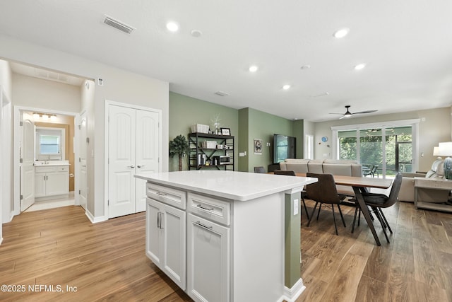 129 Oyster Shell Ter, Ponte Vedra, FL 32081 - kitchen with open floor plan, light wood-type flooring, a center island, ceiling fan, and recessed lighting