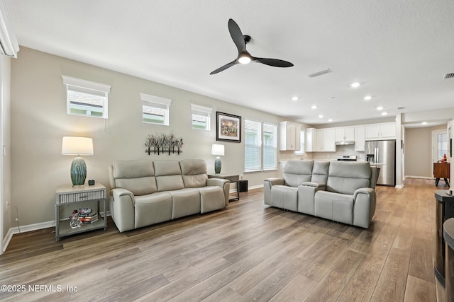 129 Oyster Shell Ter, Ponte Vedra, FL 32081 - living area featuring light wood-style flooring, ceiling fan, and recessed lighting