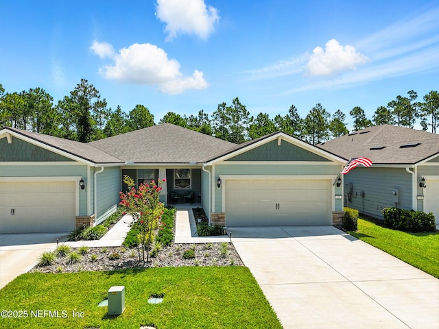 129 Oyster Shell Ter, Ponte Vedra, FL 32081 - ranch-style home with a garage, a front yard, concrete driveway, stone siding, and roof with shingles