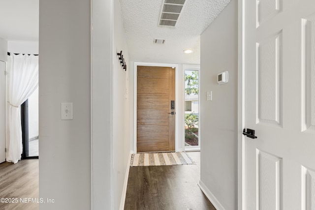 7855 La Sierra Ct Unit 7855, Jacksonville, FL 32256 - hallway featuring wood finished floors and a textured ceiling