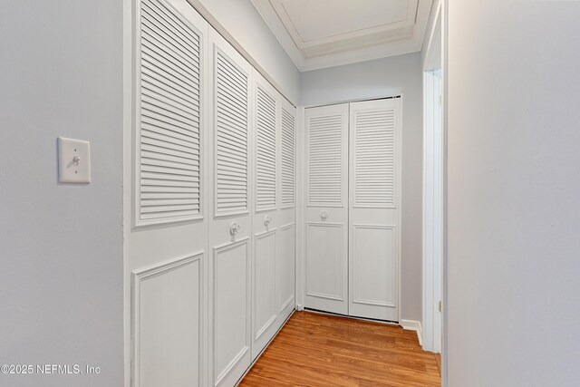 7855 La Sierra Ct Unit 7855, Jacksonville, FL 32256 - corridor featuring ornamental molding and light wood finished floors