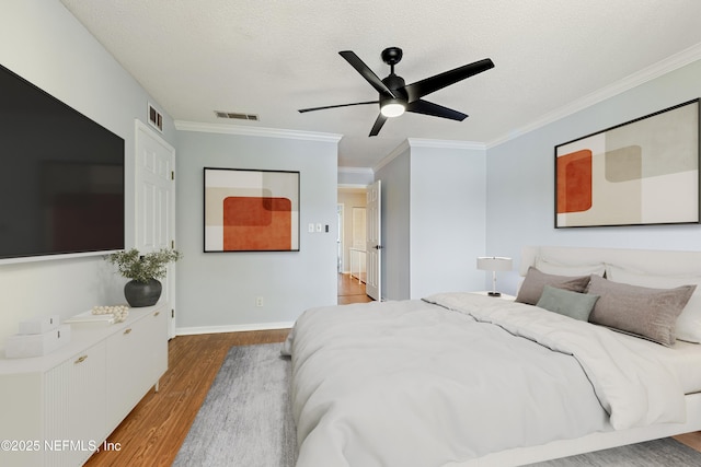 7855 La Sierra Ct Unit 7855, Jacksonville, FL 32256 - bedroom with wood finished floors, crown molding, ceiling fan, and a textured ceiling