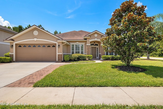 100 Cummer Way, Saint Augustine, FL 32095 - view of front of property featuring stucco siding, a garage, a front yard, driveway, and stone siding