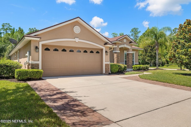 100 Cummer Way, Saint Augustine, FL 32095 - view of front facade with stone siding, stucco siding, a garage, and driveway