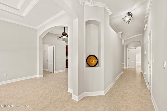 100 Cummer Way, Saint Augustine, FL 32095 - hallway featuring a textured ceiling, crown molding, arched walkways, and light tile patterned floors