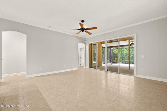 100 Cummer Way, Saint Augustine, FL 32095 - empty room featuring arched walkways, crown molding, ceiling fan, and light tile patterned floors