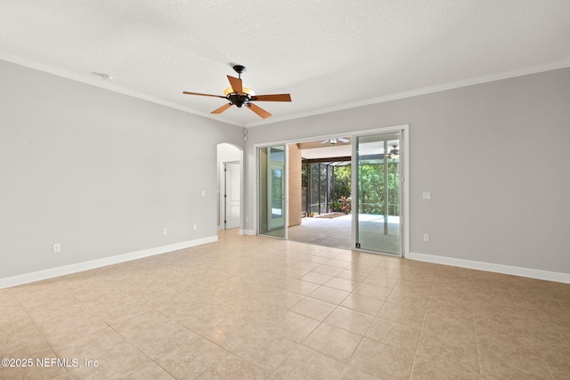 100 Cummer Way, Saint Augustine, FL 32095 - unfurnished room with ornamental molding, a ceiling fan, a textured ceiling, light tile patterned flooring, and arched walkways