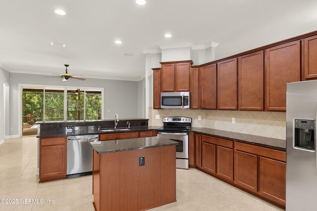 100 Cummer Way, Saint Augustine, FL 32095 - kitchen featuring stainless steel appliances, a peninsula, ornamental molding, decorative backsplash, and a center island