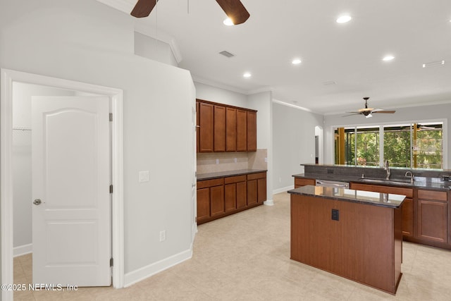 100 Cummer Way, Saint Augustine, FL 32095 - kitchen with a ceiling fan, a kitchen island, crown molding, backsplash, and recessed lighting