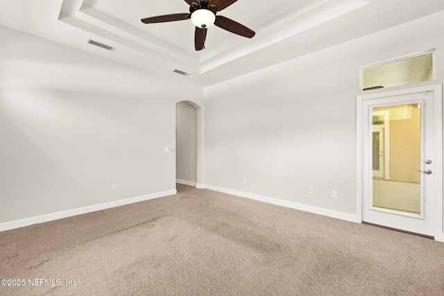 100 Cummer Way, Saint Augustine, FL 32095 - empty room with carpet flooring, a ceiling fan, arched walkways, and a raised ceiling