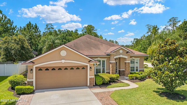 100 Cummer Way, Saint Augustine, FL 32095 - view of front of home featuring stone siding, stucco siding, a garage, and concrete driveway