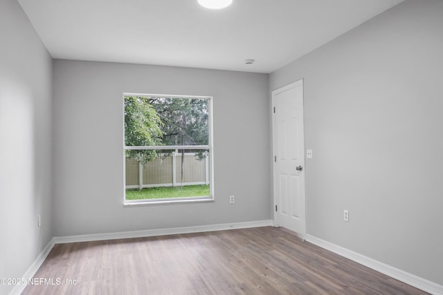 204 S Forsyth Ln, Bunnell, FL 32110 - spare room featuring wood finished floors