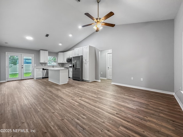 204 S Forsyth Ln, Bunnell, FL 32110 - kitchen with stainless steel appliances, open floor plan, ceiling fan, wood finished floors, and light countertops