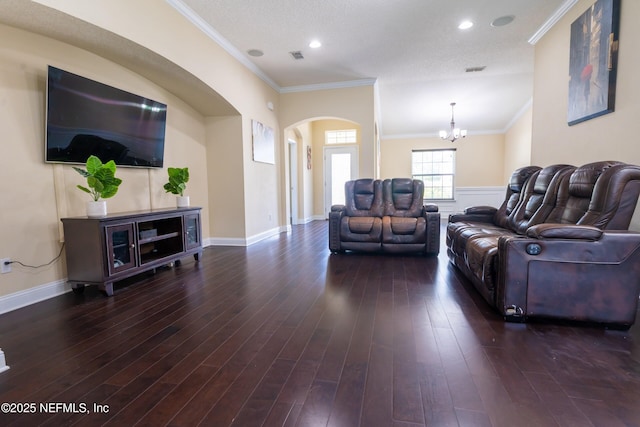 11115 Parkside Preserve Way, Jacksonville, FL 32257 - living area with a chandelier, arched walkways, crown molding, wood finished floors, and recessed lighting
