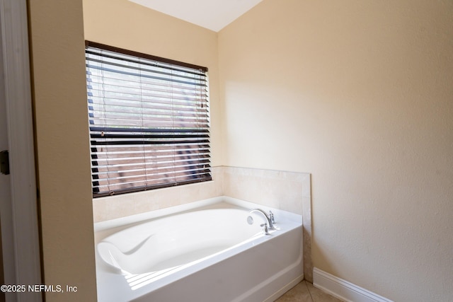 11115 Parkside Preserve Way, Jacksonville, FL 32257 - bathroom with a garden tub and tile patterned floors