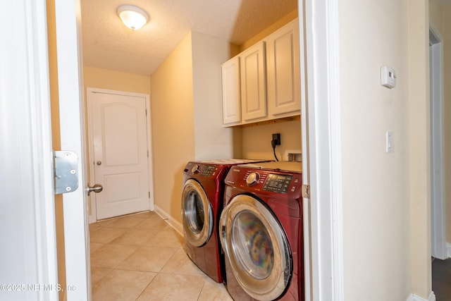 11115 Parkside Preserve Way, Jacksonville, FL 32257 - washroom with cabinet space, washing machine and clothes dryer, a textured ceiling, and light tile patterned flooring