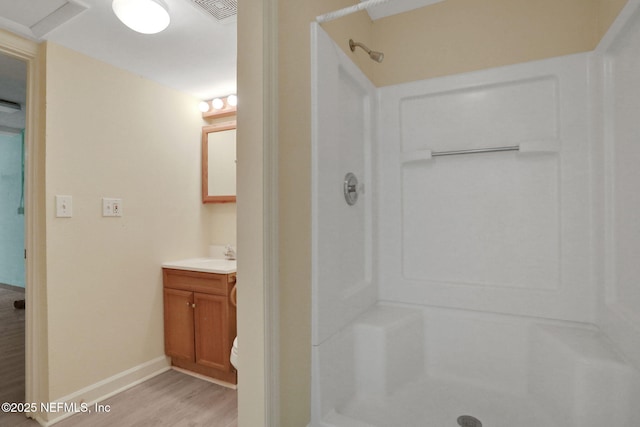 2785 Holly Point Rd E, Orange Park, FL 32073 - full bathroom featuring a shower stall, vanity, and wood finished floors