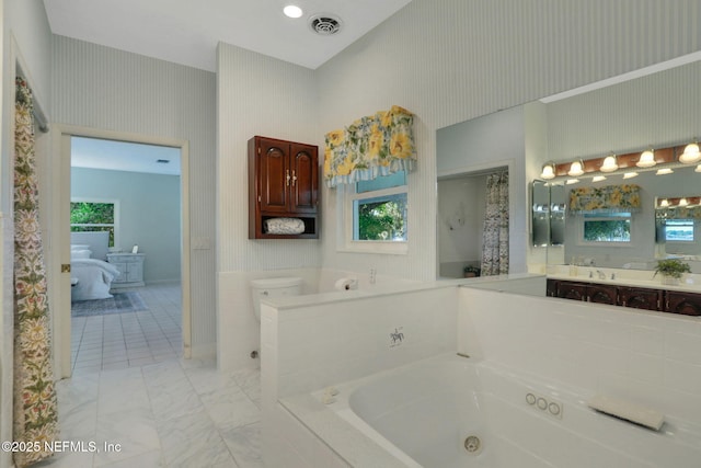 2785 Holly Point Rd E, Orange Park, FL 32073 - full bathroom featuring a whirlpool tub, vanity, ensuite bath, a high ceiling, and marble finish flooring