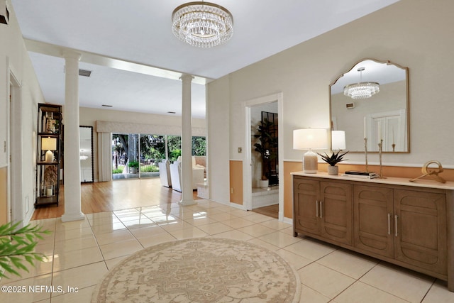 2785 Holly Point Rd E, Orange Park, FL 32073 - bathroom featuring ornate columns, tile patterned floors, a chandelier, and vanity