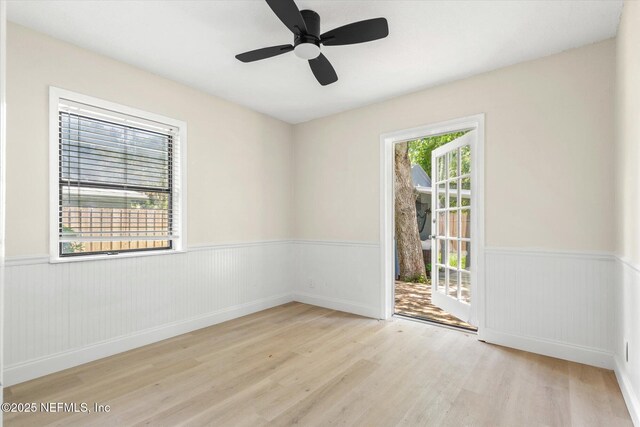 165 Sherry Dr, Atlantic Beach, FL 32233 - spare room featuring wainscoting, wood finished floors, and ceiling fan