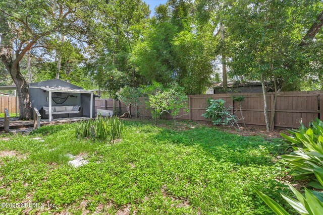 165 Sherry Dr, Atlantic Beach, FL 32233 - fenced backyard featuring an outdoor living space