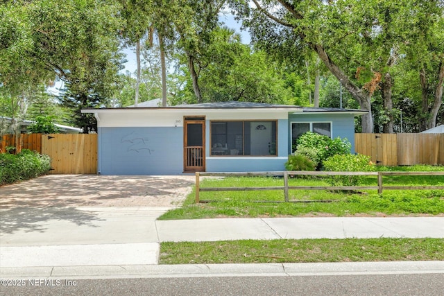165 Sherry Dr, Atlantic Beach, FL 32233 - view of front of property with a fenced front yard and driveway