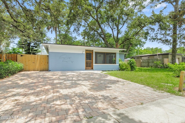165 Sherry Dr, Atlantic Beach, FL 32233 - mid-century home featuring a gate