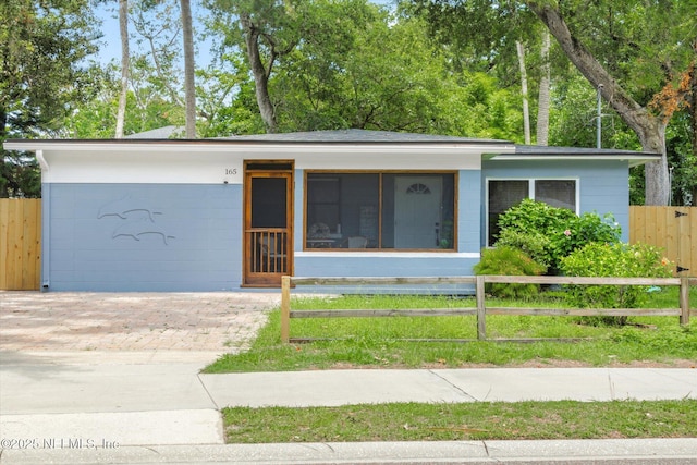 165 Sherry Dr, Atlantic Beach, FL 32233 - single story home with a fenced front yard