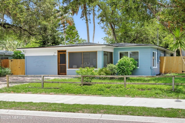 165 Sherry Dr, Atlantic Beach, FL 32233 - view of front of home with a fenced front yard