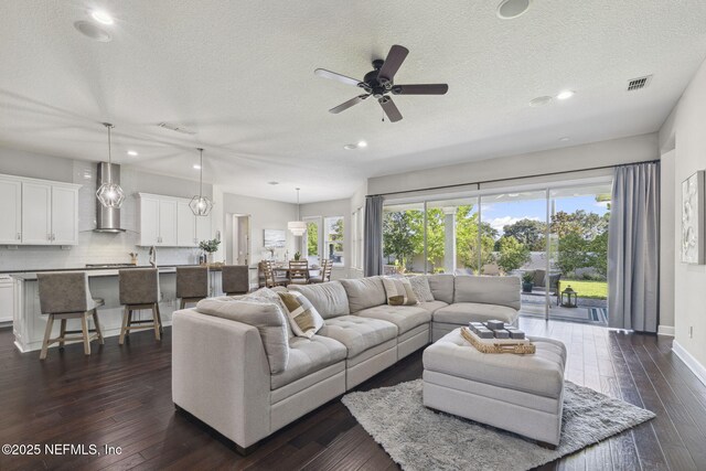 168 Bronson Pkwy, Saint Augustine, FL 32095 - living room with a textured ceiling, recessed lighting, ceiling fan, and dark wood-style floors