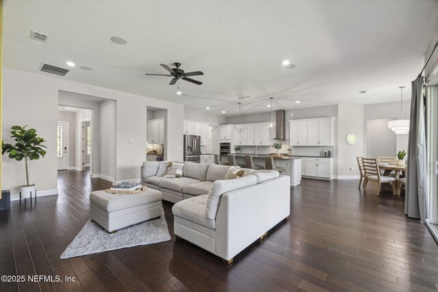 168 Bronson Pkwy, Saint Augustine, FL 32095 - living room featuring a ceiling fan, dark wood-type flooring, recessed lighting, and a textured ceiling