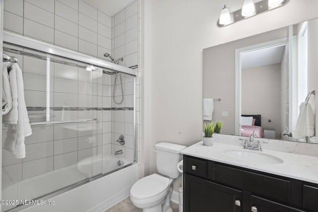 168 Bronson Pkwy, Saint Augustine, FL 32095 - full bath with vanity, bath / shower combo with glass door, and ensuite bathroom