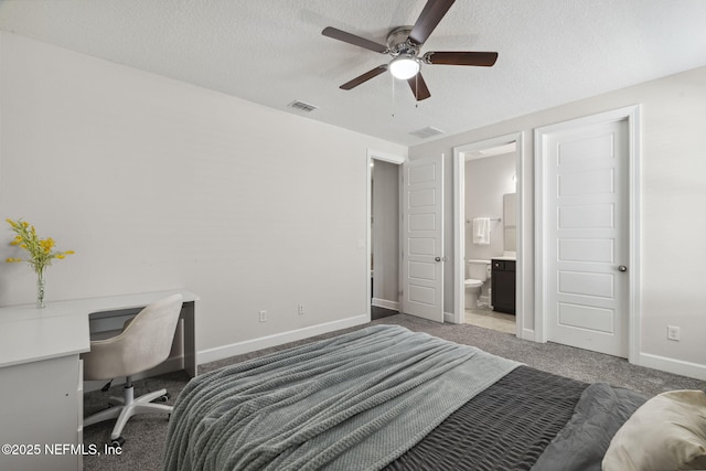 168 Bronson Pkwy, Saint Augustine, FL 32095 - carpeted bedroom with a textured ceiling, an office area, and ensuite bath