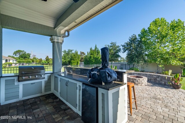 168 Bronson Pkwy, Saint Augustine, FL 32095 - fenced backyard with a fire pit, area for grilling, and a patio