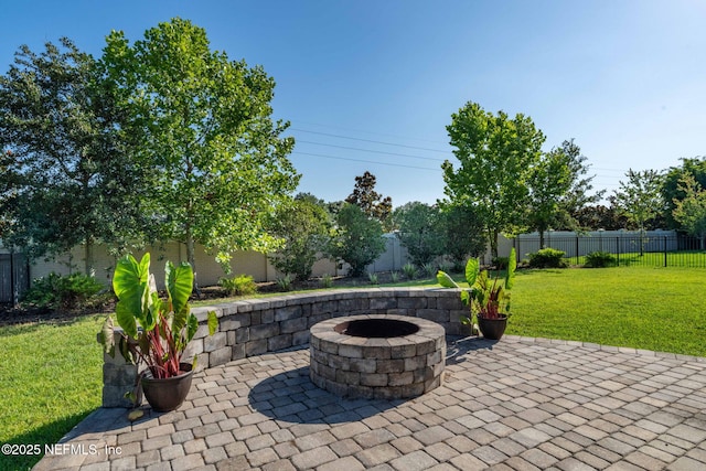 168 Bronson Pkwy, Saint Augustine, FL 32095 - fenced backyard with an outdoor fire pit and a patio area