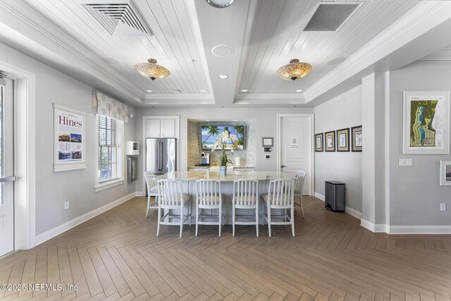 168 Bronson Pkwy, Saint Augustine, FL 32095 - dining space with a raised ceiling, wood ceiling, ornamental molding, and recessed lighting