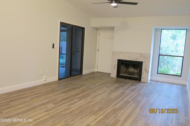 3801 Crown Point Rd Unit 1332, Jacksonville, FL 32257 - unfurnished living room with a ceiling fan, wood finished floors, a premium fireplace, and vaulted ceiling