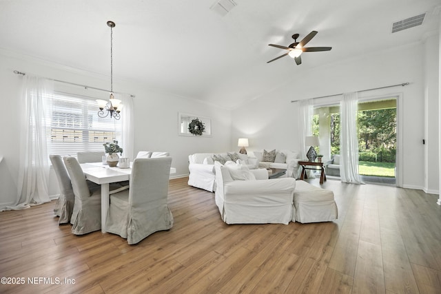 6105 Caladesi Ct, Jacksonville, FL 32258 - dining room featuring a chandelier, plenty of natural light, ceiling fan, wood finished floors, and vaulted ceiling