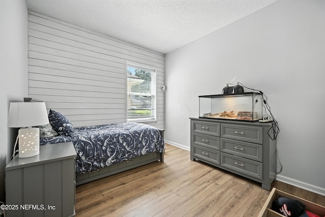 6105 Caladesi Ct, Jacksonville, FL 32258 - bedroom with wood finished floors and a textured ceiling