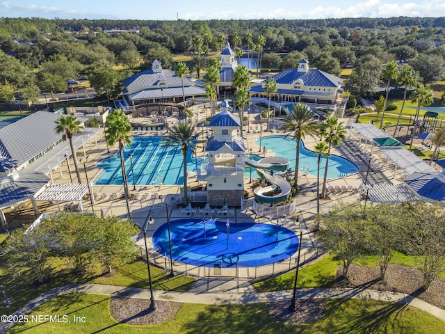 6105 Caladesi Ct, Jacksonville, FL 32258 - drone / aerial view of a pool area and a heavily wooded area