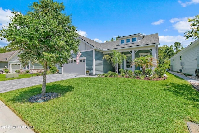 150 Calumet Dr, Saint Johns, FL 32259 - view of front of house featuring board and batten siding, a front lawn, a garage, and driveway