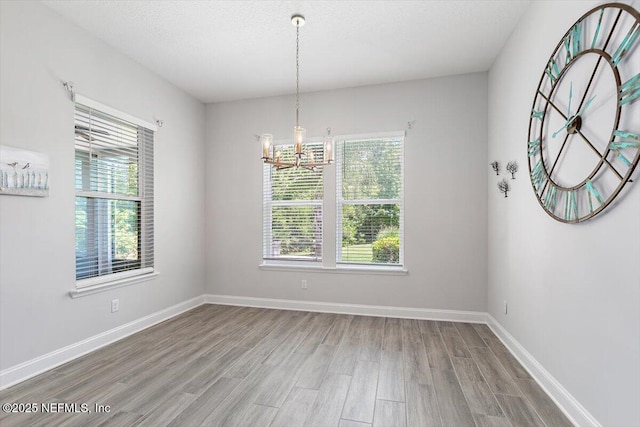 150 Calumet Dr, Saint Johns, FL 32259 - unfurnished room featuring healthy amount of natural light, a chandelier, and wood finished floors